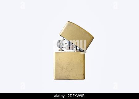 An old gasoline lighter in bronze color Stock Photo