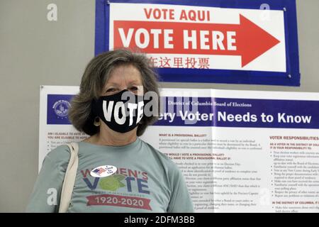 A woman places a sticker after voting at a polling station during a first day of early voting in U.S. presidential election in Washington on October 27, 2020. Photo by Yuri Gripas/ABACAPRESS.COM Stock Photo