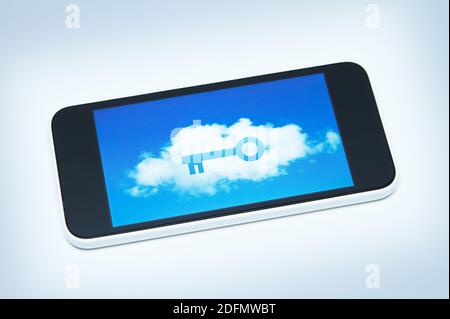Secure smart phone with a key over a cumulus cloud on its screen. All logos removed. Stock Photo