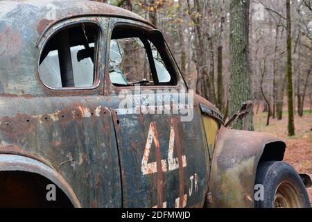 An abandoned vintage race car at the former Occoneechee Speedway, a dirt oval NASCAR track converted to a hiking trail in 2003 Stock Photo