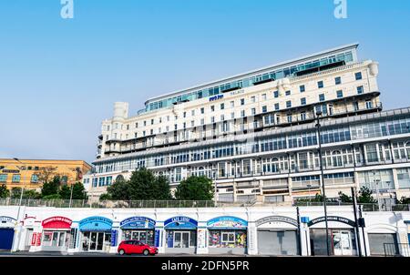 Park Inn Radisson Palace hotel overlooking the sea, with a range of cafes beneath at street level. Stock Photo