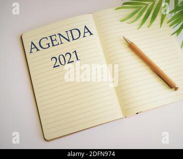 Conceptual hand writing showing Agenda. Business photo showcasing list items that participants hope to accomplish at meetings. Agenda 2021 text writte Stock Photo