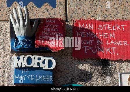 Outstretched hand and writing Murder in the Mediterranean Sea, Sea rescue of refugees, 3D art object on a wall, Open Air Gallery Flingern Stock Photo