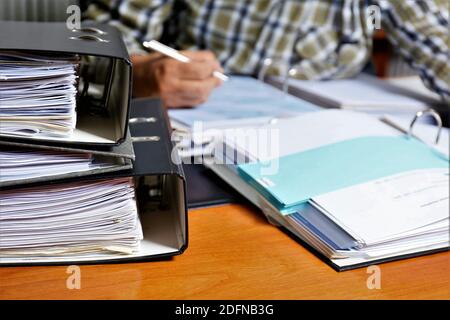 person writing on a notebook Stock Photo