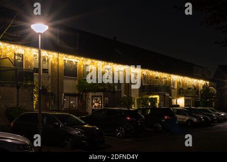 Houses decorated with Christmas lights in a Dutch town Stock Photo