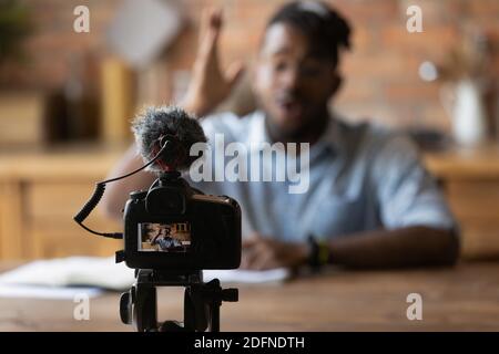 Close up focus on photo camera with microphone recording video. Stock Photo