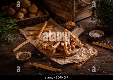 Homemade snack, baked sticks with cumin. Crispy sticks with seeds Stock Photo
