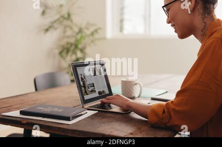 Female magazine editor working on her laptop. businesswoman working from home on a laptop. Stock Photo