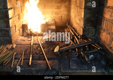 Details of blacksmithing tools in the forge Stock Photo