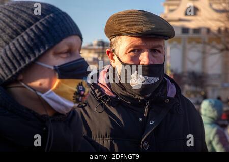 Moscow, Russia. 5th of December, 2020 People wear protective masks during an unauthorized political protest on Pushkinskaya square in the center of Moscow during novel coronavirus COVID-19 pandemic in Russia Stock Photo