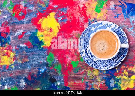 Freshly brewed coffee in a blue stylish cup on a colored background Stock Photo