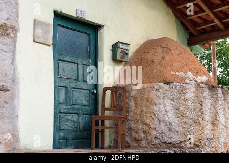 entrance of a traditional house with an old owen in a rural village in Montesinho Braganca, Portugal Stock Photo