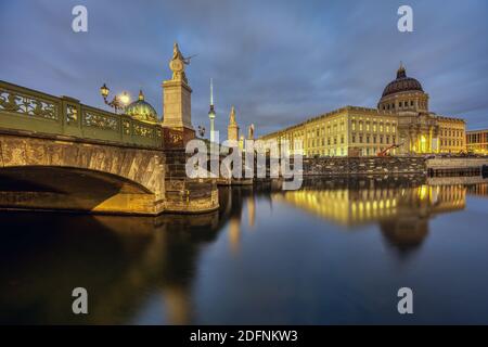 The rebuilt Berlin City Palace with the Television Tower at night Stock Photo