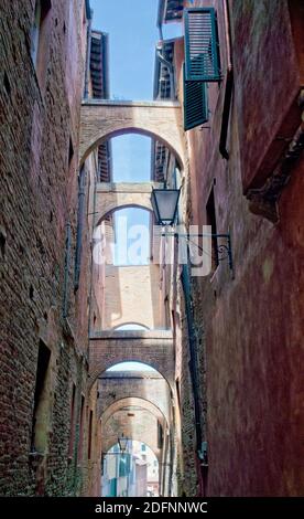 Ancient alley in Siena - Italy Stock Photo