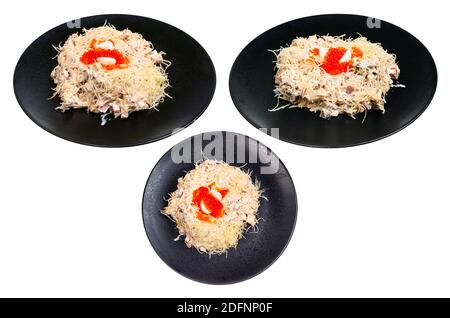set from served Quail Nest salad from ham, veal and beef tongue, grated cheese, dressed with mayonnaise and decorated by quail egg and salmon caviar o Stock Photo