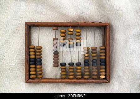 Frame of wooden abacus on canvas surface. Stock Photo