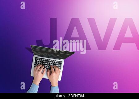 Conceptual Java programming language with person with laptop Stock Photo