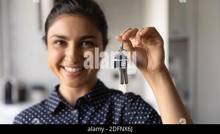 Happy young indian female excited about buying apartment of dream Stock Photo