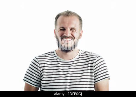Laughing bearded mature man in a striped T-shirt. 30-35 years old. Isolated on white Stock Photo