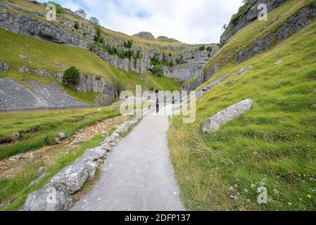 Malham Tarn, Yorkshire Dales National Park, Yorkshire, UK - People hiking on the pathway at Malham Tarn, Yorkshire, Uk Stock Photo