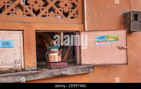 Indian man looking out from his tea portal, Jaipur, Rajasthan, India Stock Photo