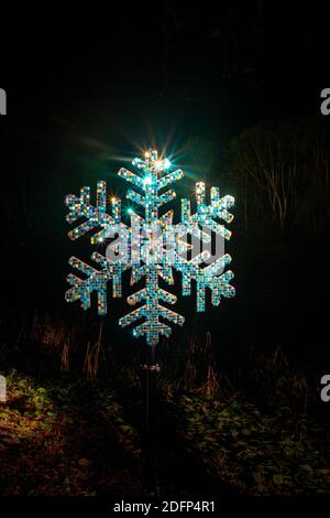 Illuminated snowflake on the Blenheim Christmas lights trail. Stock Photo