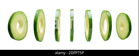 Avocado slices levitating in the air isolated on white background Stock Photo