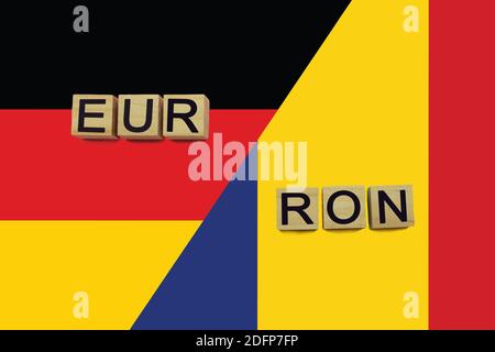 Germany and Romania currencies codes on national flags background. International money transfer concept