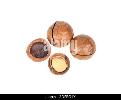 Macadamia nuts with a split half on a white background, top view Stock Photo
