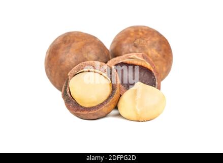 Delicious macadamia nuts with kernels on a white background Stock Photo