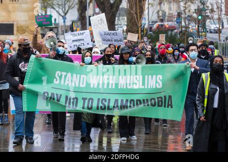 Bristol, UK. 6th Dec 2020. Anti- Islamophobia protesters march through Bristol city centre demanding more protection for Muslims. They condemned the French government’s actions towards Muslims and highlighted the case of Shukri Abdi who drowned in near Manchester, which they do not believe was an accident. Redorbital/Alamy Live News Stock Photo