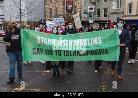 Bristol, UK. 6th Dec 2020. Anti- Islamophobia protesters march through Bristol city centre demanding more protection for Muslims. They condemned the French government’s actions towards Muslims and highlighted the case of Shukri Abdi who drowned in near Manchester, which they do not believe was an accident. Redorbital/Alamy Live News Stock Photo