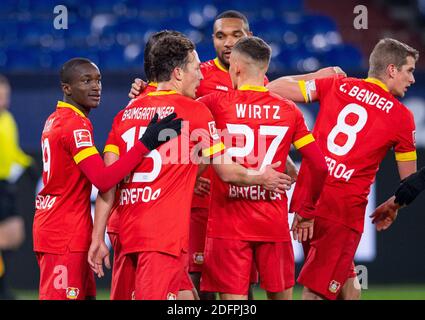 Gelsenkirchen, Germany. 06th Dec, 2020. Football: Bundesliga, FC Schalke 04 - Bayer Leverkusen, 10th matchday at the Veltins Arena. The players from Leverkusen cheer the goal for the 0:1. Credit: Guido Kirchner/dpa - IMPORTANT NOTE: In accordance with the regulations of the DFL Deutsche Fußball Liga and the DFB Deutscher Fußball-Bund, it is prohibited to exploit or have exploited in the stadium and/or from the game taken photographs in the form of sequence images and/or video-like photo series./dpa/Alamy Live News Stock Photo