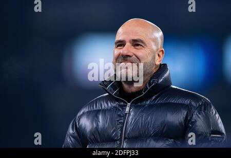 Gelsenkirchen, Germany. 06th Dec, 2020. Football: Bundesliga, FC Schalke 04 - Bayer Leverkusen, 10th matchday at the Veltins Arena. Leverkusen coach Peter Bosz, is on the sidelines before the game. Credit: Guido Kirchner/dpa - IMPORTANT NOTE: In accordance with the regulations of the DFL Deutsche Fußball Liga and the DFB Deutscher Fußball-Bund, it is prohibited to exploit or have exploited in the stadium and/or from the game taken photographs in the form of sequence images and/or video-like photo series./dpa/Alamy Live News Stock Photo