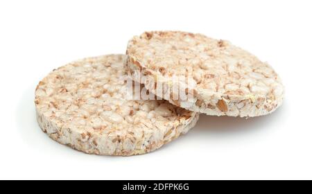Two round crispbreads isolated on white. Side view. Stock Photo