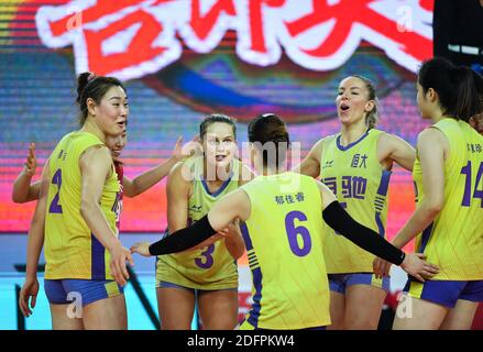 Jiangmen, China's Guangdong Province. 6th Dec, 2020. Players of Guangdong team celebrate scoring during the Goup C match between Guangdong team and Zhejiang team at the thrid stage of the 2020-2021 season Chinese Women's Volleyball Super League in Jiangmen, south China's Guangdong Province, Dec. 6, 2020. Credit: Liu Dawei/Xinhua/Alamy Live News Stock Photo