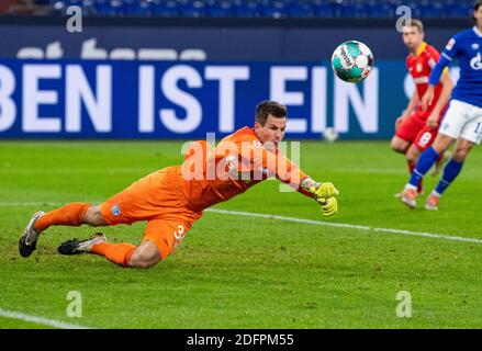 Gelsenkirchen, Germany. 06th Dec, 2020. Football: Bundesliga, FC Schalke 04 - Bayer Leverkusen, 10th matchday at the Veltins Arena. Schalke's goalkeeper Michael Langer fends off a ball. Credit: Guido Kirchner/dpa - IMPORTANT NOTE: In accordance with the regulations of the DFL Deutsche Fußball Liga and the DFB Deutscher Fußball-Bund, it is prohibited to exploit or have exploited in the stadium and/or from the game taken photographs in the form of sequence images and/or video-like photo series./dpa/Alamy Live News Stock Photo