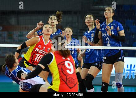 Jiangmen, China's Guangdong Province. 6th Dec, 2020. Players of both sides compete during the Goup D match between Shanghai team and Jiangsu team at the thrid stage of the 2020-2021 season Chinese Women's Volleyball Super League in Jiangmen, south China's Guangdong Province, Dec. 6, 2020. Credit: Liu Dawei/Xinhua/Alamy Live News Stock Photo