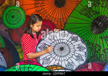 Parasol painter at Bagan, Myanmar (Burma), Asia in February - parasol, parasols, umbrella, umbrellas Stock Photo