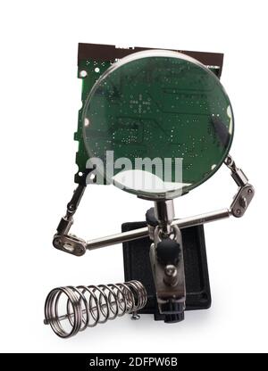 Soldering clamp holder, magnifier magnifying glass jewelry clamp, helping hand isolated on a white background. Multifunctional assistant. Technology. Stock Photo