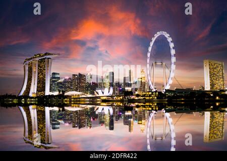 Stunning view of the Singapore's skyline during a beautiful and dramatic sunset.  Singapore is a sovereign island city-state in Southeast Asia. Stock Photo