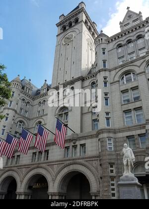 Washington DC, USA - September 29, 2019: Trump International Hotel entrance with the American flags and the statue of Benjamin Franklin, situated in t Stock Photo