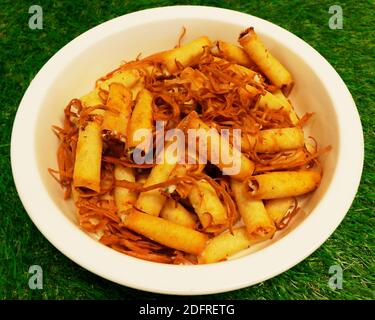 Lebanese Pastries food, deep fried crispy cheese rolls in a bowl Stock Photo