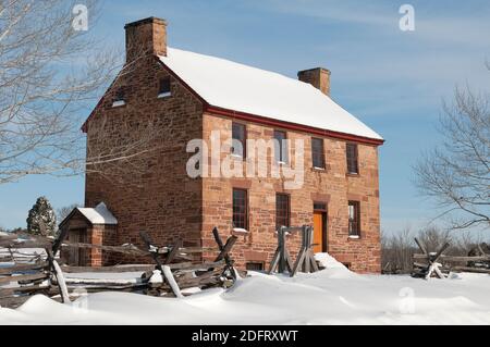 The Stone House at Manassas National Battlefield is blanketed in snow during winter. Stock Photo