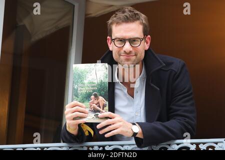 French writer Nicolas Mathieu poses with his book 'Leurs enfants apres eux' after winning the Prix Goncourt, France's top literary prize, on November 7, 2018 in Paris, France. Photo by Nasser Berzane/ABACAPRESS.COM Stock Photo