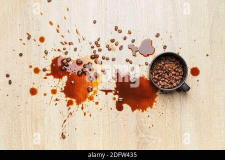 Cup and coffee stains on wooden background Stock Photo