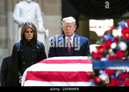 US President Donald J. Trump (R) and his wife, Melania (L), pay respects to former President George H.W. Bush as he lies in state in the Rotunda of the US Capitol in Washington, DC, USA, 03 December 2018. President Bush died at the age of 94 on 30 November 2018; he was the 41st President of the United States (1989âÂ€Â“1993). Stock Photo