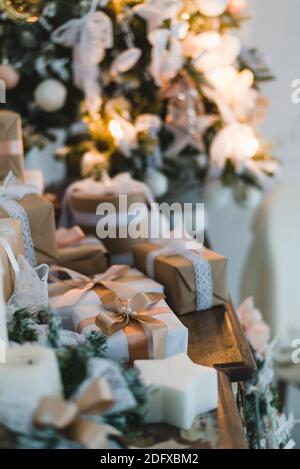 Classy Christmas hand made gifts box presents with brown bows. Selective focus Stock Photo