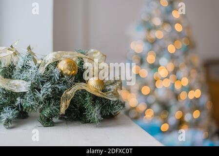 Gold and blue Christmas background of de-focused lights with decorated tree Stock Photo