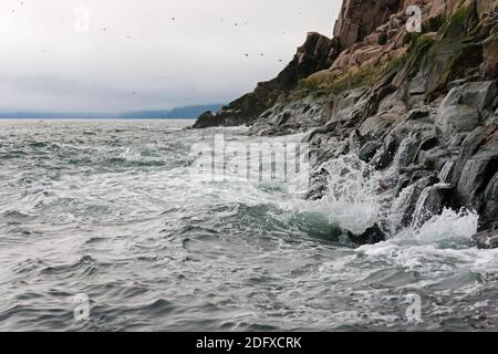 Rocky cliff with ocean, Cape Archen, Bering Sea, Russian Far East Stock Photo